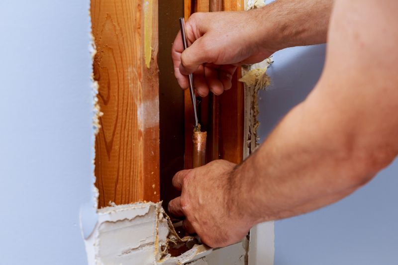 Plumber Fixing a Pipe